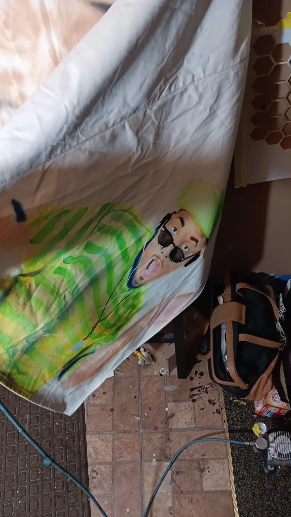 Custom neon portrait airbrush work on apparel