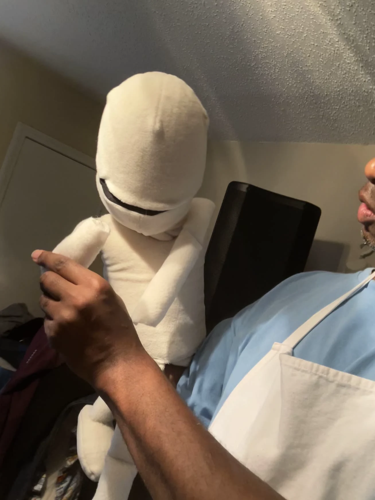 Jonathan assembling a custom foam puppet figure by hand