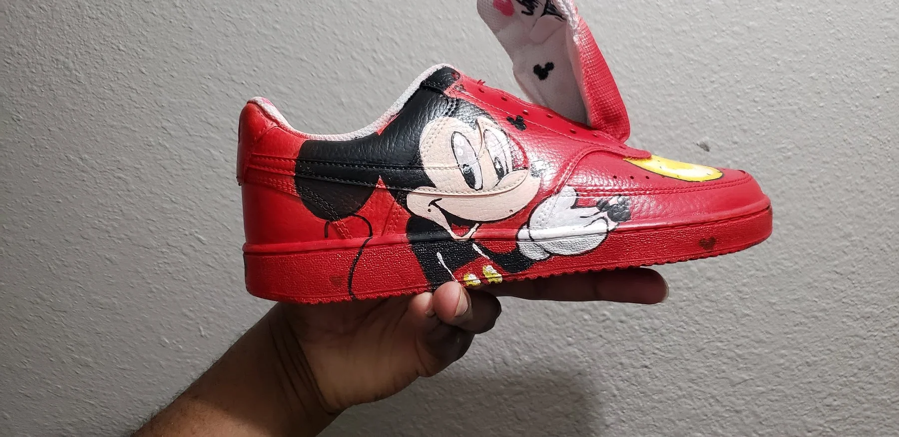 Custom airbrushed red character sneaker