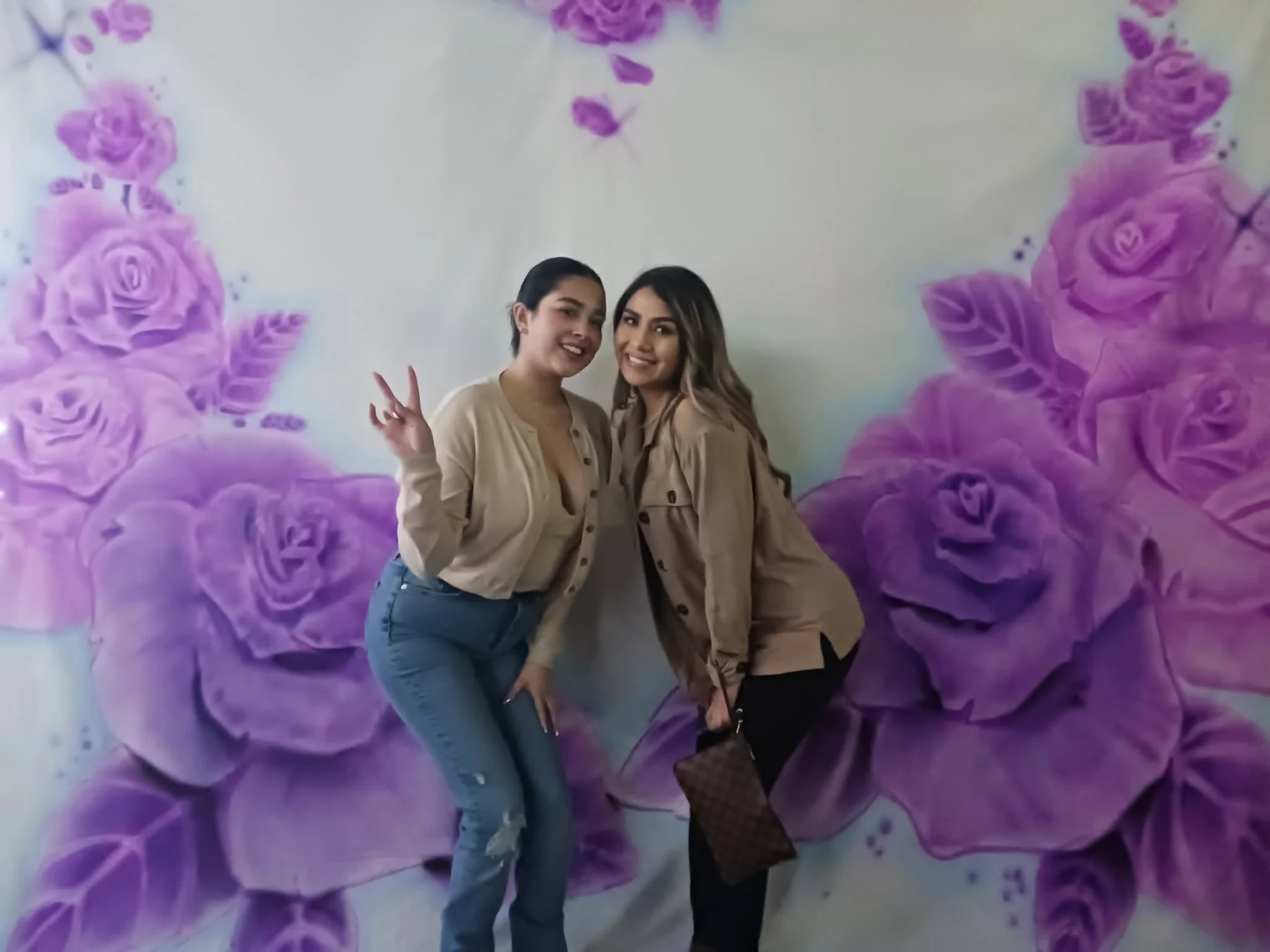 Event guest moment in front of a floral display