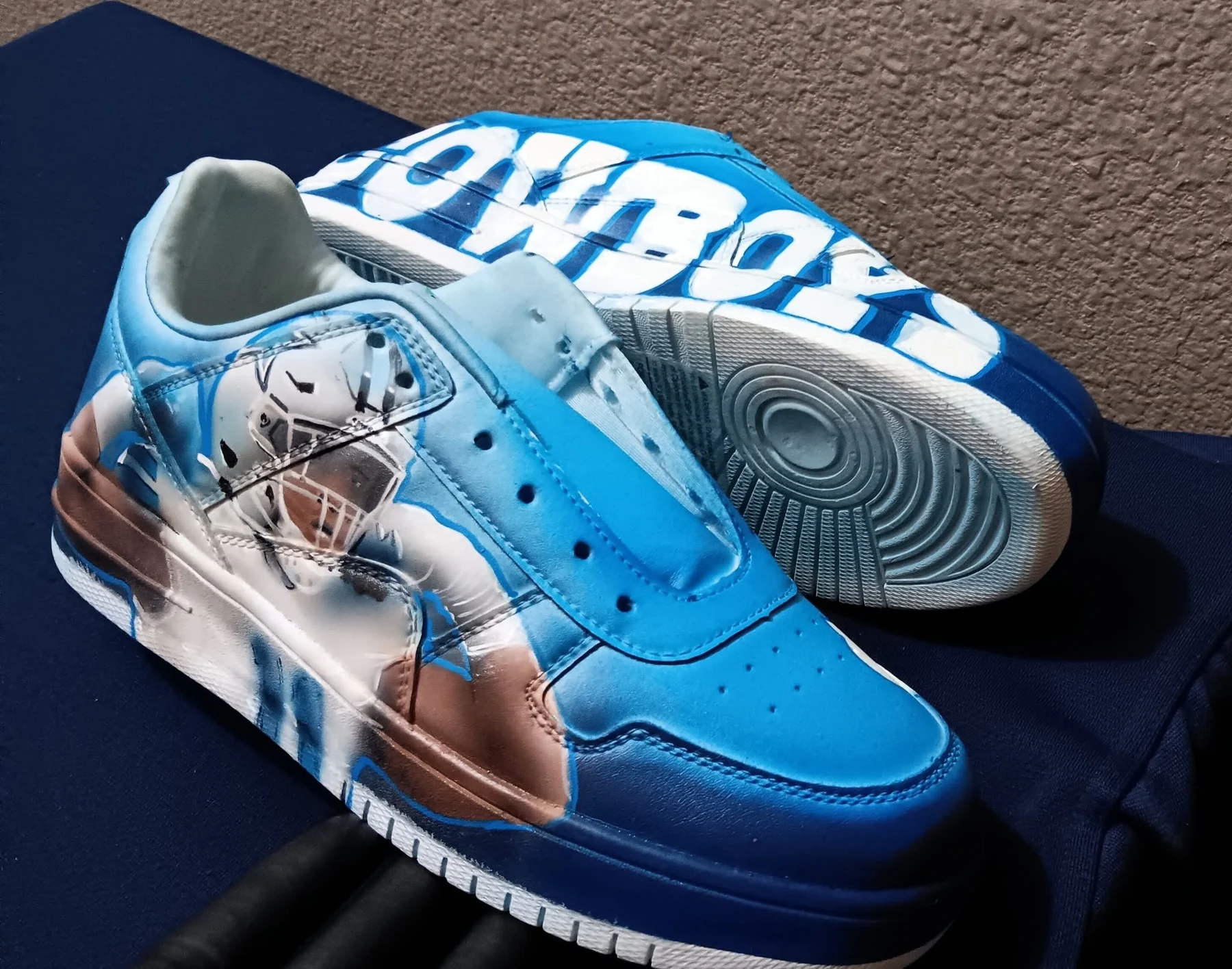 Blue custom airbrushed sneaker pair
