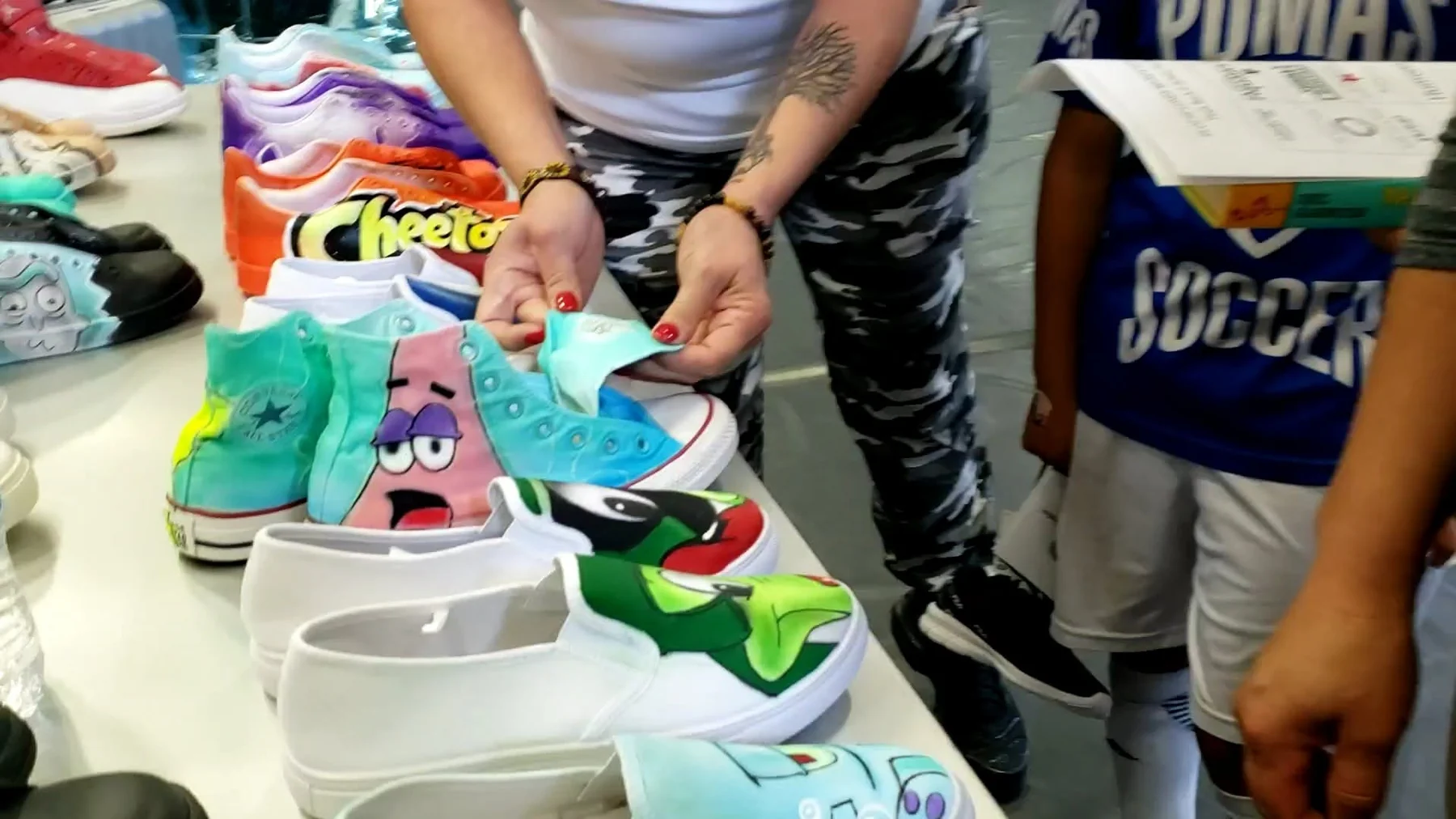 Live custom shoe artwork being shown during an event