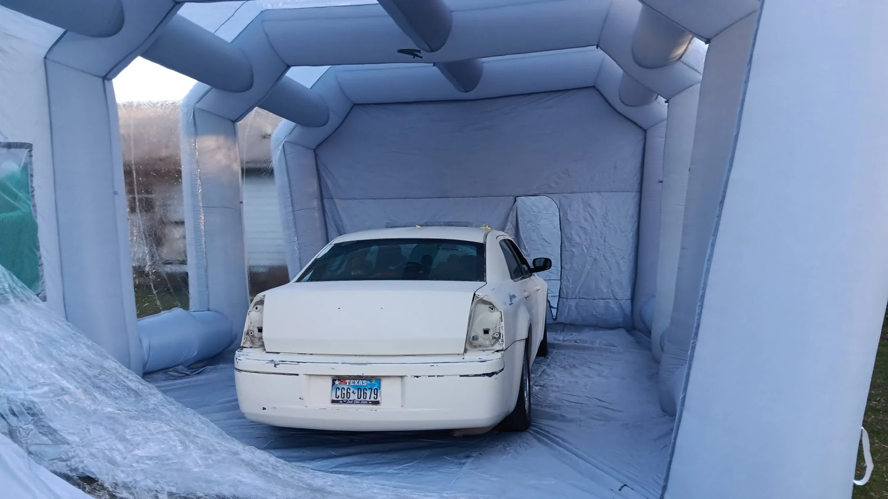 Custom automotive paint project inside a spray booth