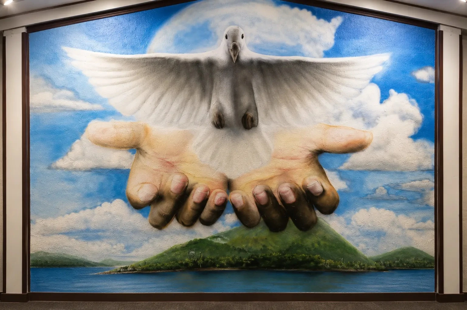 Jonathan Taylor dove and hands mural